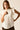 Blusa sin mangas blanca con volantes