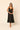 Vestido midi cuello pico volantes negro