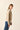Chaqueta bolsillos flecos beige