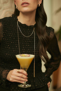 Collar largo dorado con flecos