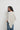 Capa de punto con brillo beige