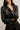 Chaqueta efecto piel botones negro