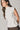 Top cuello alto frunce lateral natural