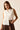 Camisa blanca sin mangas con botones