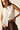 Camisa blanca sin mangas con botones