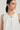 Top fluido con detalle de piedras blanco