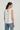 Top fluido con detalle de piedras blanco