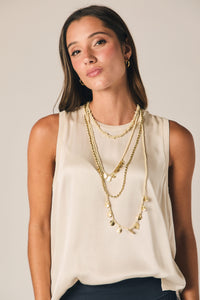 Top sin mangas ribete color natural