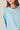Blusa cuello chimenea celeste