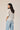 Top cuello pico puntilla celeste