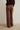 Pantalón cuadros tachas berenjena
