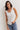 Top volante cuello pico blanco
