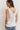 Top volante cuello pico blanco