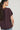 Blusa tachas flecos berenjena