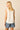 Blusa sin mangas blanca con cuello mao y botones