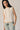 Camiseta sin mangas con tachas crudo