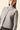 Chaqueta punto flecos gris