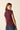 Top punto berenjena con detalle fruncido