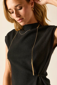 Collar largo dorado con flecos
