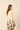 Blusa manga abullonada lazo trasero beige