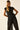Top punto negro con detalle fruncido
