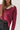 Jersey rústico cuello pico rosa