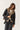 Abrigo nylon borreguito animal print negro