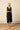 Mono midi negro con escote cruzado
