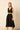 Mono midi negro con escote cruzado