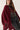 Poncho punto flecos vino
