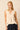 Top sin mangas beige con escote pico