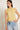 Top lino sin mangas cuello volante amarillo