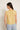 Top lino sin mangas cuello volante amarillo
