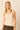 Top de punto beige con escote pico