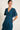 Vestido cuello pico volantes azul petróleo