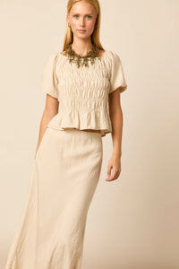 Falda midi crudo con corte al bies
