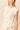 Top blanco con nudo lateral